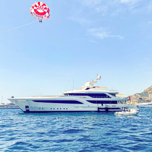 Parasailing above the yacht and Monaco